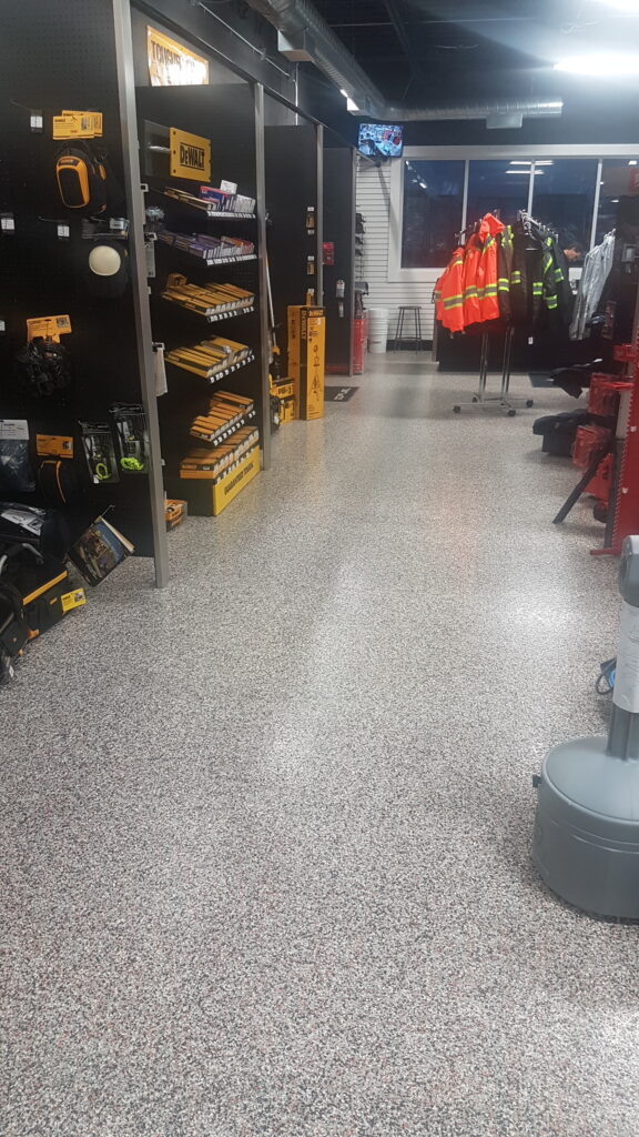 Close view of concrete floor coating work in progress